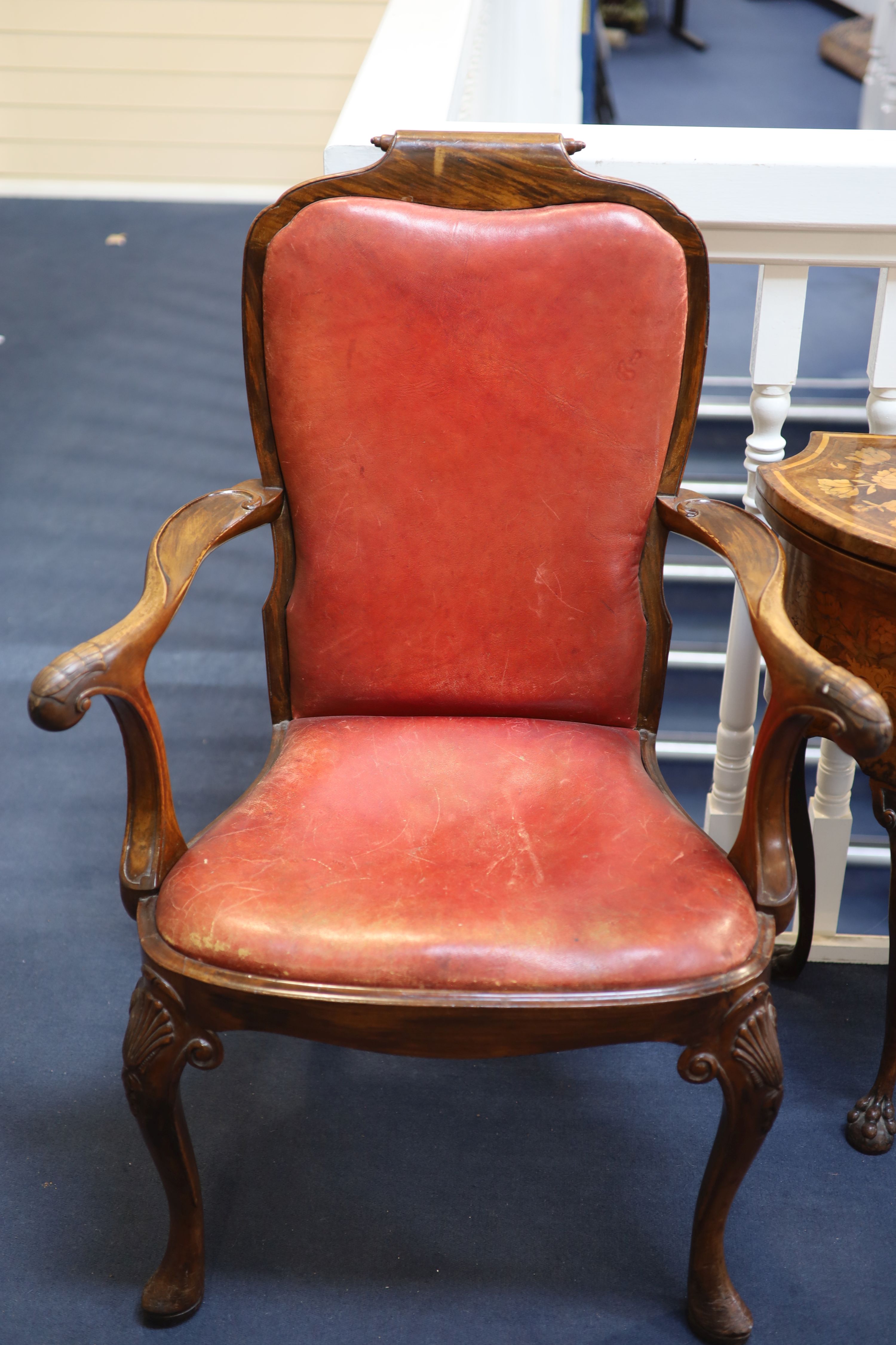 A set of four George I style walnut armchairs, first quarter 20th century,